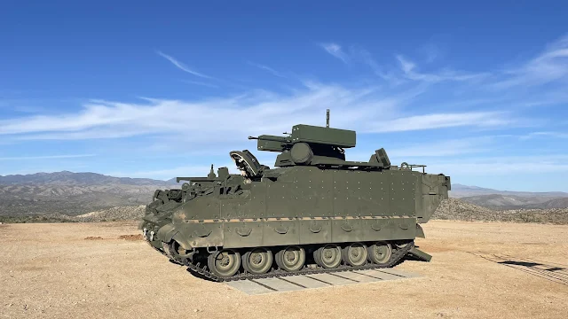 Cover Image Attribute: BAE Systems’ green Armored Multi-Purpose Vehicle (AMPV) Counter-Unmanned Aircraft System (C-UAS) prototype with the desert mountain range in the background. /Source:  BAE Systems