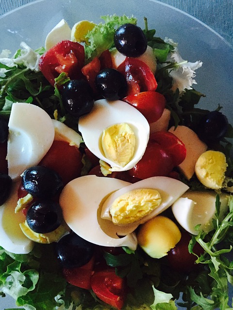 Colorful Lettuce Salad: Hard boiled eggs, black olives, red peppers, 