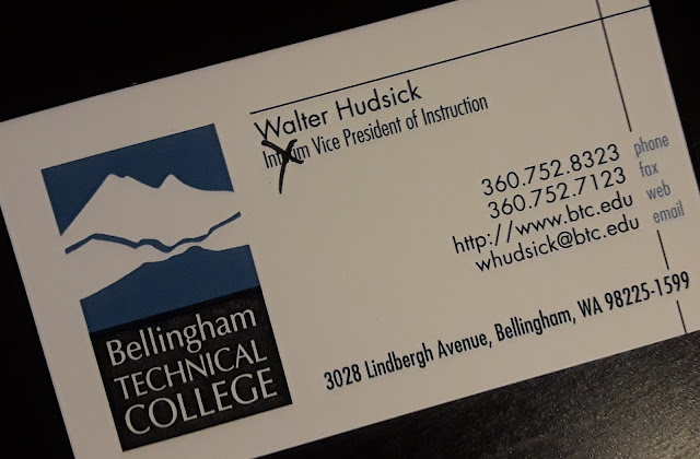 Business card with the word Interim crossed out before the words Vice President of Instruction