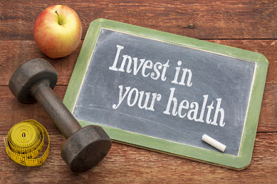 A chalkboard message that reads, "Invest in your health."