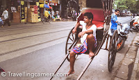 When I saw these hand pulled rickshaws in Kolkata city, I was not comfortable with the thought of sitting on this rickshaw which would be pulled by a human being. But later I realized that my thought is just doing loss to their business. These folks are happy doing this work and we should appreciate that. These Hand pulled Rickshaws definitely make Kolkata different from other cities of India. Finally I took a ride and it was worth an experience. It's bit costly as compared to other mode of commuting in Kolkata, but it's not fair to compare. This experience made me read more about these hand pulled Rickshaws of Kolkata and that's when I realised how complicated it is in terms of origin of these rickshaws, how Britishers started using them for status and then gradually it became part of India society. And these days, there are different theories behind their existence in Kolkata city of West Bengal.   Since the end of the 19th century, hand-pulled rickshaws have been running on the streets of Kolkata city of India. These hand pulled rickshaws of Kolkata have seen city evolve on various fronts like social, economic & political way. In the post-independence era of India, the hand-pulled rickshaws were introduced by the British to show their authority and establish their supremacy over the poor Indians. Lot of folks from Bihar and Odisha used to run these hand pulled rickshaws in Kolkata city and even today lot of these rickshaw owners are from Bihar state of India. Immigrants from Bangladesh have also entered into it to make money in a different city/country.   The British were the dominant in Asia and the usage of a humans to pull another human definitely served their purpose of reinforcing the master-slave power hierarchy. Post World War II, colonialism declined in Asia and the hand-pulled rickshaw faded out of use from British colonies. Strangely, the legacy of rickshaws continued in Calcutta long after the British Empire was gone and long after the communist government in China banned (1949) the use of rickshaws.