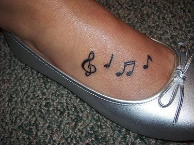 music note tattoo designs. Small and Cute Tattoo Designs