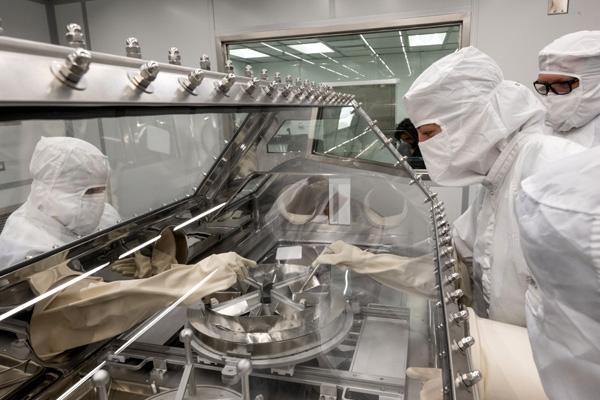 Inside the newly-built OSIRIS-REx Curation Laboratory at NASA's Johnson Space Center in Houston, Texas, technicians rehearse the opening of the asteroid sample canister that will be delivered to Earth from NASA's OSIRIS-REx spacecraft this September.