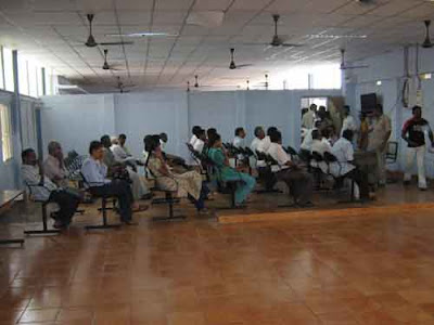 people waiting in the waiting hall for their turn