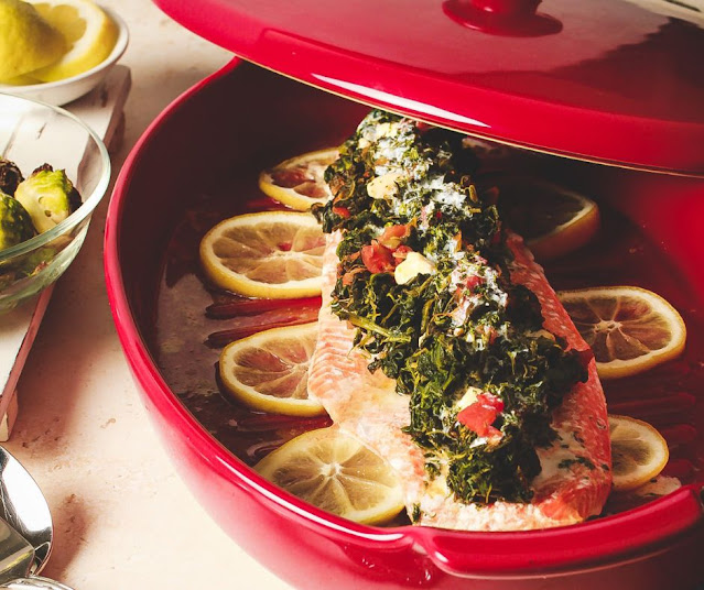 red ceramic dish with slamon fish