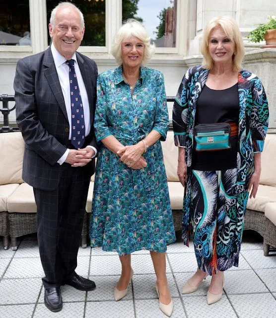 The Duchess of Cornwall wore a floral print midi dress by Fiona Clare. The lunch organized by Gyles Brandreth and the Oldie