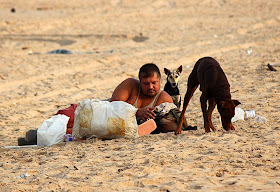 poor foreigner on an Indian beach