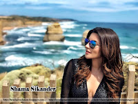 shama sikander hot, outdoor near the sea in black specs with deepest boobs show