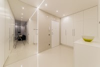 White Wooden Cabinet Beside White Wooden Door