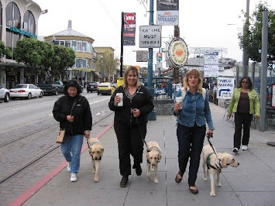 Raisers and their pups at Fisherman's Wharf in San Francisco