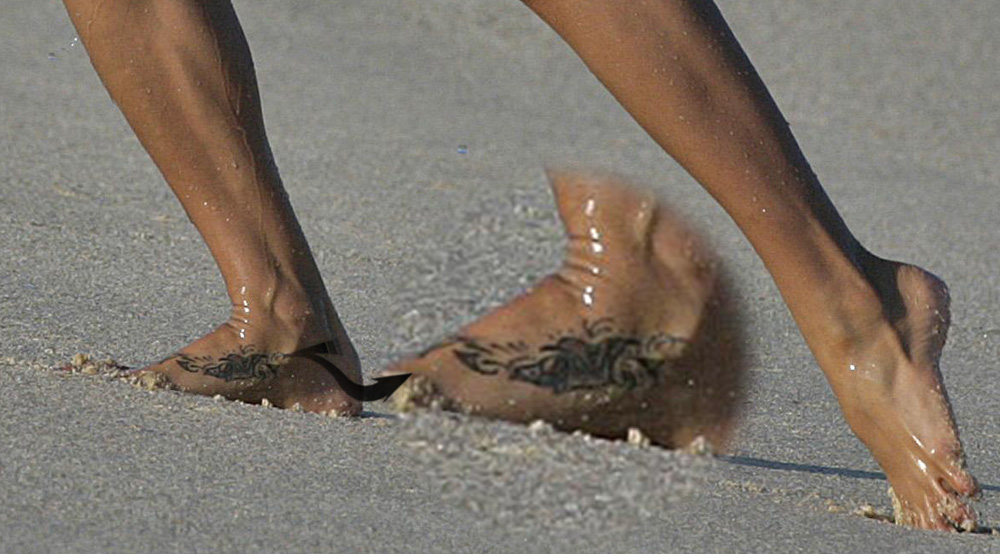 Brooke Burke flower tattoo on foot.