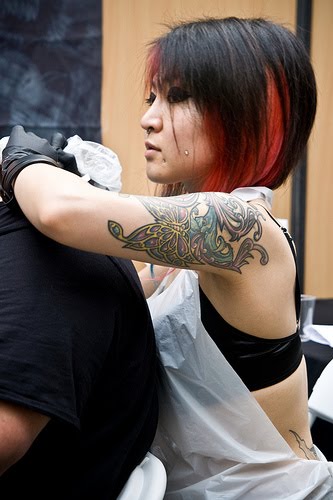 Dark colored tattoos are nice to look at on the shoulder especially 