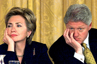 President Trump orders a standing ovation for Hillary and Bill Clinton - and finally gets them to smile after humiliated couple sit glumly through his swearing-in and hear crowd chant, 'Lock Her Up'