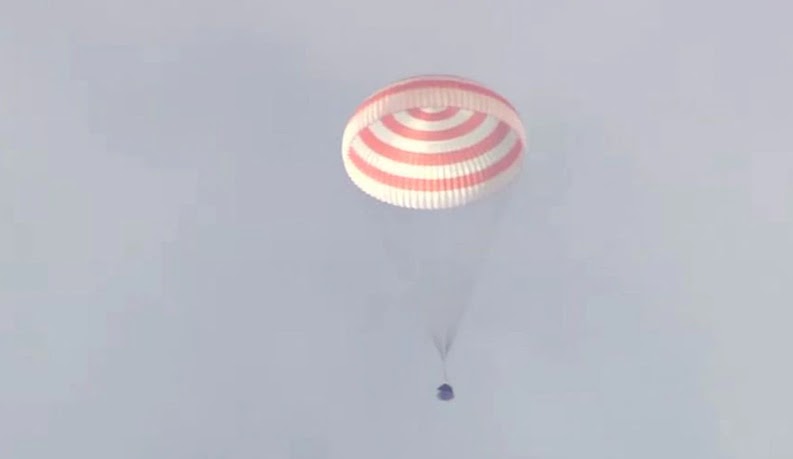 In this still image taken from video, the Soyuz MS-19 space capsule carrying International Space Station (ISS) crew members NASA astronaut Mark Vande Hei and Roscosmos cosmonauts Anton Shkaplerov and Pyotr Dubrov descends beneath a parachute in a remote area outside Zhezkazgan, Kazakhstan, on March 30, 2022.