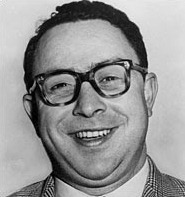 circa 1955:  Headshot portrait of American journalist Art Buchwald smiling in a plaid sports coat.  (Photo by Hulton Archive/Getty Images)