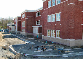 new FHS - sidewalks and landscaping along side