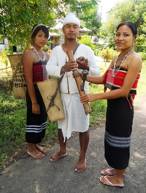A young man and two young ladies with Bongcher traditional dresses and attires