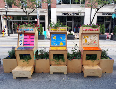 Installation with 3 manual interactives built of wood and hosting plants but designed to look like video arcade cabinets