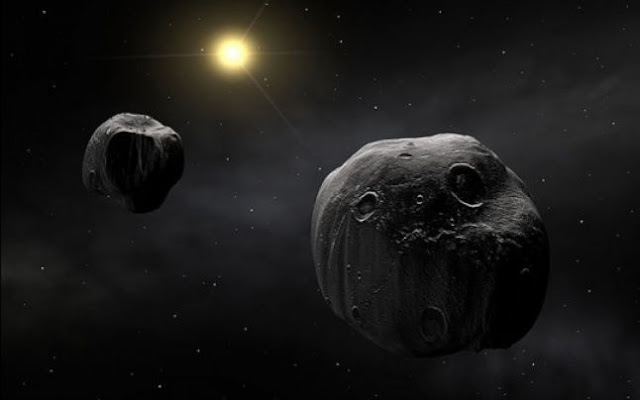 dois asteroides orbitando o Sol