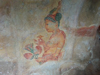 Ancient Lankan Princess Lady holds flowers, fresco graffiti in Sigiriya, world cultural heritage, point of interest