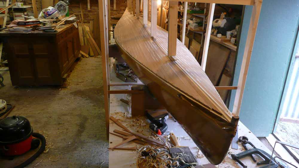 scaffold frame around the kayak allows temporary timbers and wedges 