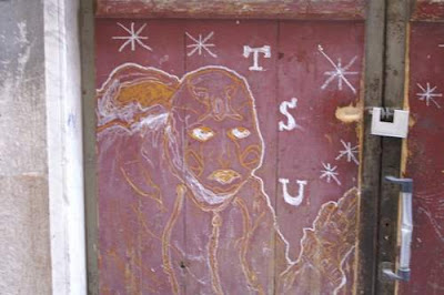 Graffiti image of an astral projection, hippy girl from the old town centre of Genoa, Italy.