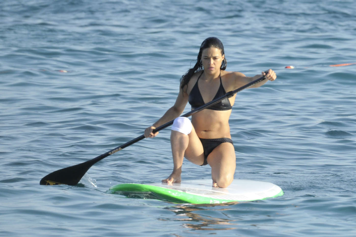 Michelle Rodriguez in Bikini Paddleboarding in Sardinia ...