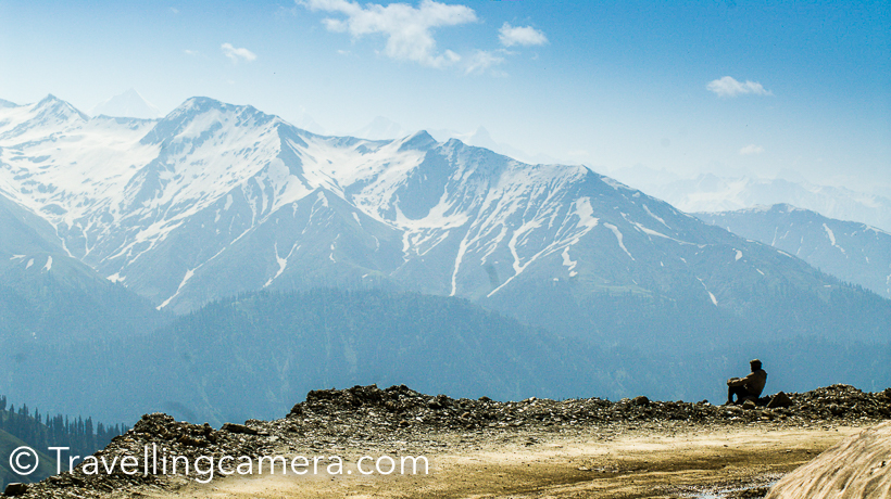 When in Kashmir, we drove to Daksum, Anantnag, Sinthan Top and Kishtwar from Srinagar. This road also connects Srinagar with Jammu, but we had taken Mughal road  to hit Kashmir Valley when drove from Delhi. These is one of the most beautiful terrains of Kashmir Valley. In fact, it would be unfair to compare various terrains in Kashmir Valley, because all of these have unique character and equally beautiful. This Photo Journey shares more about this route, it's terrains and some important facts.Daksum is surrounded by dense forests with Bringhi River flowing right through its center. Daksum has been a popular destination for explorers and adventure lovers. Green meadows around Daksum look amazing and if you are lucky, you can find few shepherds singing some local songs. We met a gentleman, who loves playing flute. Unfortunately we didn't want to get clicked, so I don't have his photograph. All this may sound filmy but that's what you experience in Kashmir Valley.Clouds of Kashmir Valley are very interesting and naughty. They keep playing games with you, especially hide-n-seek.I clicked hundreds of cloud photographs in Kashmir. If you are lucky, these clouds also try to surround you from closer distance. Especially in early morning and late evening. Most of the times, these hills get drizzle.  On these terrains around Sinthan Top, you feel like stopping your car and sit around the edge to experience the cool breeze blowing through the valley and green landscapes all around. It's a must do experience at a place where you find peace around these hills.Road connecting Srinagar with Sinthan Pass goes through beautiful landscapes full of green meadows, dense forests, cities, some beautiful mosques and paddy fields.Above photographs is clicked during Mughal Rally (A motorsport event organized by Himalayan Motorsports). The Sinthan pass connects Kashmir valley with Jammu Province through Kistwar. Pass is 12500 feet above sea level and is snow-capped for most of the year. It is located at the Anantnag-Kokernag-Kishtwar NH1B Highway and is 130 km south of Srinagar and 72 kilometers from Anantnag and approximately 50 kilometers from Kokernag.These curvy hills offer you unmatchable views of snow capped hills shimmering with sunlight and intense shadows of clouds. Flora and fauna of Kashmir valley welcomes you with open arms on the way to Sinthan top. There are very few tourists come to this part of Kashmir valley. Some of the most popular destinations in Kashmir are Srinagar, Pehalgaon, Gulmarg and Leh.Sinthan Top has no local population. Shepherds from adjoining places like Kokernag, Duksum, and tourists and those working in the tourism industry may stay overnight in tents. There is a small tea shop at top, which serves tea and basic snacks to tourists and army folks roaming around.This post is sharing only the landscapes of green meadows and some of the hills full of snow. But the drive from Srinagar to Sinthan Pass offers you lot more than that. Foothills of Sinthan Pass on both sides have very beautiful villages full of wooden houses, which are usually seen in movies. All of those seemed old and most of the newer houses near road were all modern with concrete construction.  From Sinthan pass, there is an uphill trek to Sinthan top. The uphill climb to Sinthan top is a difficult and steep. Initially we hesitated to take this challenge but when did it, we found it worth. That was one of the best moments from our kashmir valley.How to reach this part of Kashmir Valley -Srinagar has nearest airport.  Anantnag railway station is also connected with Kashmir Railway that runs from Baramulla to Qazigund. If you are in Jammu or Srinagar, you can hire a taxi or take bus for this part of Kashmir Valley.Lodging around Sinthan Pass, Anantnag -There are not many places to stay in Daksum. A few decent options can be found in Anantnag or Kokernag. Now some of the NGOs are actively running homestays in this part of Kashmir. One can find some goods option to stay in Anantnag. There are enough dhabas and restaurants serving local and Indian cuisine. It's recommended to do more research about the place and do advance booking. Also keep a track of local news, before you head there.This part of Kashmir and Peer Panjal mountain ranges are like heaven on earth. These grand views hypnotize all travellers and tourists crossing through Sinthan Pass. Every turn offers you new surprise and journey remains interesting.You can find lot of snow around Sinthan Pass, but remains of snow can be seen at distant places as well. Above photograph share true colors and mood of Kashmir - the bright blue sky, pure white clouds and snow covered green meadows.Two companions of Travellingcamera who were accompanying me in Kashmir exploration.