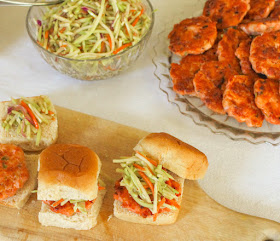 Food Lust People Love: These simple salmon sliders are easy to make and take mere minutes to cook. Topped with sesame ginger slaw, they are fresh and flavorful, a fun appetizer or main course your friends and family will love.