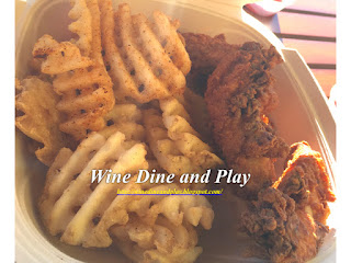 The organic chicken tender and waffle fries at the Flock And Stock restaurant at Sparkman's Wharf in Tampa, Florida