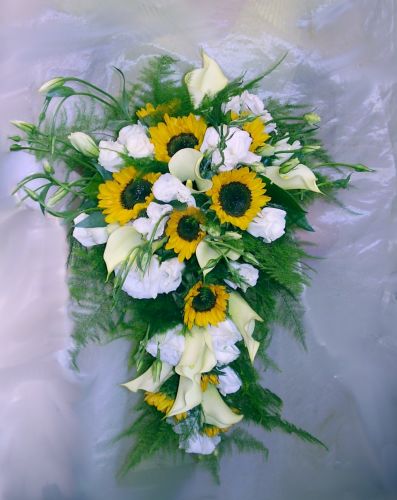 Sunflowers white roses and white calla lilies bridal bouquet