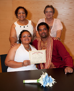 Tameka, Manoj and their mothers with the marriage certificate