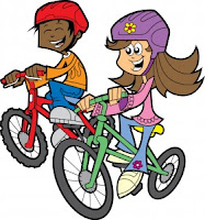 A boy and a girl riding a bikes