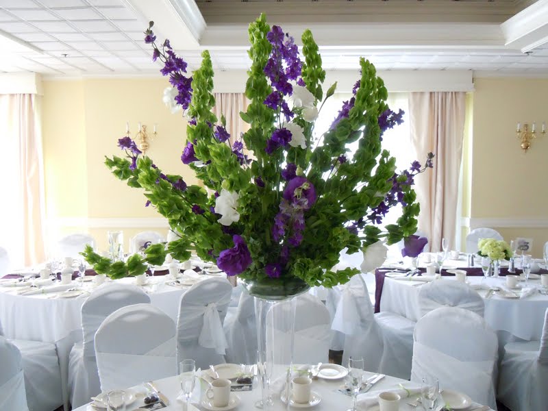 tall centerpiece of Bells of Ireland purple and white lisianthus 