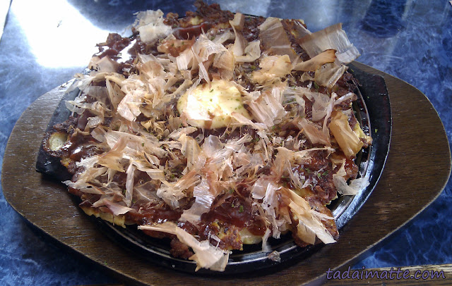 Okonomiyaki topped with bonito and aonori at Okonomi House in Toronto. Great Japanese food!