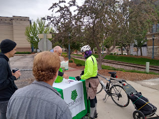 cyclist and others at information table