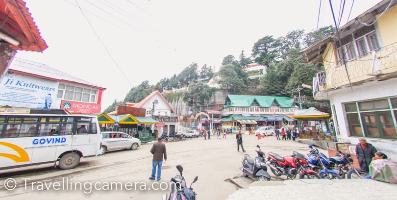 Recently I was in Dalhousie to visit my niece and during one of the days we planned to walk around the mall road in Dalhousie town This Photo Journey shares about some of the interesting places on mall road and few tips for folks planning to visit Dalhousie.Gandhi Chowk is probably the most happening place in Dalhousie town. Dalhousie town is comparatively a smaller town as compared to other popular hill stations and that's why it's a peaceful place. Although don't expect this peaceful enviornment during summers :), which lot of folks from Punjab come here with their kids to spend vacations. Gandhi Chowk is a good place for shopping in Dalhousie. Check out Apple products and some fruit wines produced in Himachal. We also bough few packs of apple pickle, which is yet to be tasted :)These beautiful snow covered mountains of Pir Panjal can be seen from Gandhi Chowk. First two photographs are clicked at Gandhi Chowk. The popular St John's church is situated on Gandhi Chowk and the very first photograph in this Photo Journey shows the same.Mall road connects Gandhi Chowk with Subhash chowk on other side of the town. This whole road overlooks at the beautiful Pir Panjal mountain ranges covered with snow. These hills had got fresh snowfall few days back and they were looking awesome. In above photograph, the bottom part shows cantt area of Dalhousie which is next to Banikhet.  The clouds around these snow capped hills were continuously changing the hues and every shade was looking brilliant.  Throughout the mall road, various seating arrangement are done. All these places are quite cleaner. These places are so beautifully designed that you feel like taking a pause and sit there to enjoy the brilliant of nature around Dalhousie. Above is one of the views from Mall road. This is Ravi river which keeps changing her views during the day. Many times, it's not even visible because of dense clouds all around Dalhousie town. During 3 days stay, we saw Ravi 2 times for short span of time.Mall road in Dalhousie has some of the exceptional private properties, which are quite expensive as well. Above is not a house but a school near church. I intentionally avoided clicking any personal property there.Clouds keep playing around the town and within minutes you see very contrasting enviornment. Completely hazy view at one moment and bright/clear view after a few minutes. Imagine clouds passing by you and indicating that be ready for showers in a while, so plan accordingly :).After walking through the Mall road we finally hit Subhash Chowk which exposes you to the green valley on the opposite side of snow covered Pir Panjal mountain ranges. St. Francis church is located on Subhash chowk, which is much bigger than the one on Gandhi Chowk. There is a small space in this campus, which is dedicated to colorful birds, rabits, ducks. We had a quick round of this church and got down to the Mall road for tea. Urvi, my niece, was sleeping by that time and we wanted to head back now. We called our taxi guy and headed to the home which is 4 kilometers from Dalhousie town.Apart from the Mall road, there is another smaller and beautiful pathway which connected Subhash Chowk with Gandhi Chowk. This is supposedly the preferred route for local folks who want to same time and energy :), but tourists love the Mall road walk because it exposes you to brilliant views of Himalayas.  The whole Mall road is surrounded by Deodar trees which add more to the beauty of this town. Dalhousie has been one of my favorite towns and I like the fact that it's not becoming concrete jungle like other hills stations (Shimla, Mussourie etc.)Do drop us a comment, if you want know more about the place or have some specific queries.