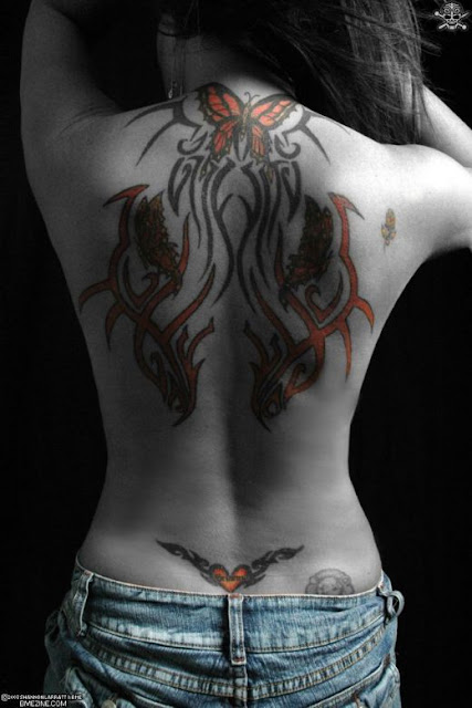 female back tattoo. butterfly ack tattoo. Female