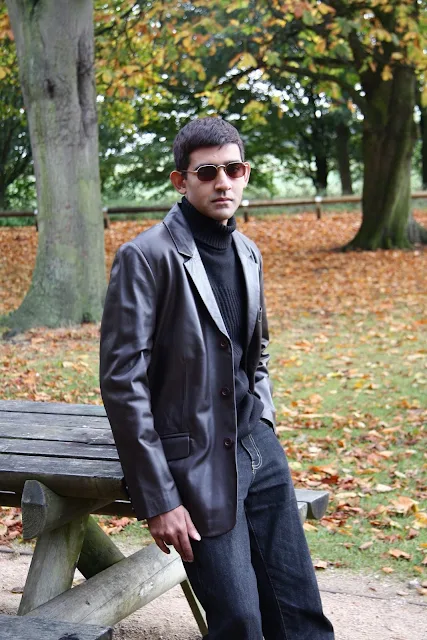 Leather Blazer wearing guy with sunglasses outside