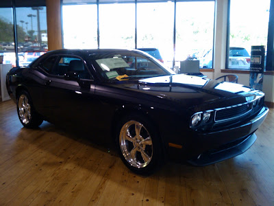 This is a 2011 Dodge Challenger R T in Blackberry Pearl it looks black 