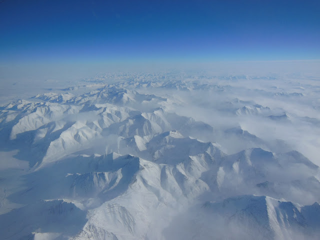 Alaskan mountains seen from high altitude aboard the NASA P-3B during the IceBridge transit flight from Thule to Fairbanks on March 21, 2013.  NASA's Operation IceBridge is an airborne science mission to study Earth's polar ice.  Image Credit: NASA/Goddard/Christy Hansen