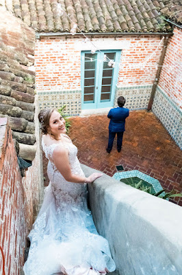 Bride walking down stairs for first look