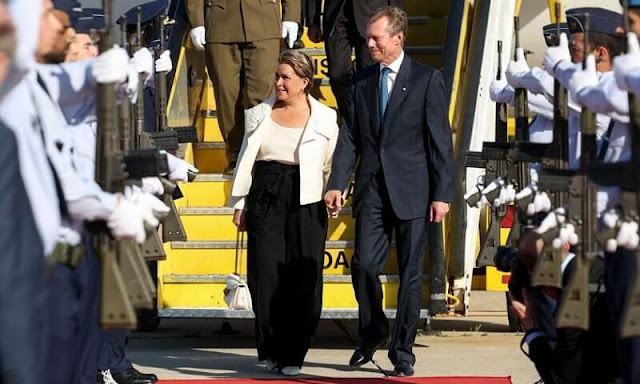 Grand Duchess Maria Teresa wore an ivory flower-applique wool-blend jacket by Valentino