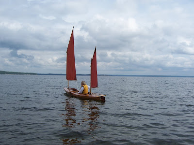 Nancy tries out a sailing canoe for the first time.