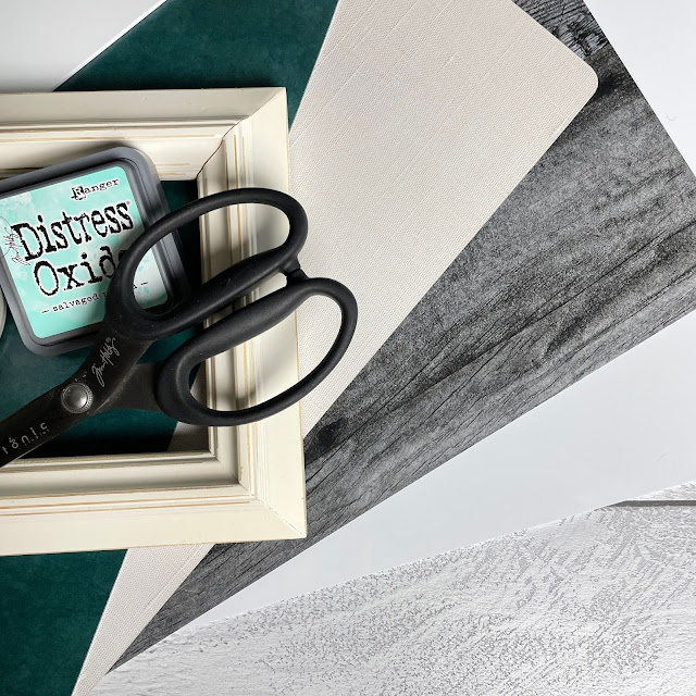 Replica Surfaces: rigid photography backdrops for paper crafting project photos including scrapbook layouts, handmade cards and mixed media; flatly example with Tim Holtz shears and Distress Oxide in Salvaged Patina and thread and ribbon with a frame.