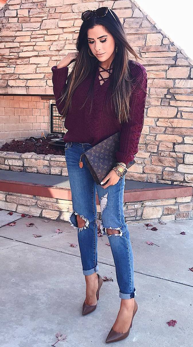 trendy outfit idea / burgundy lace up sweater + brown bag + rips + heels