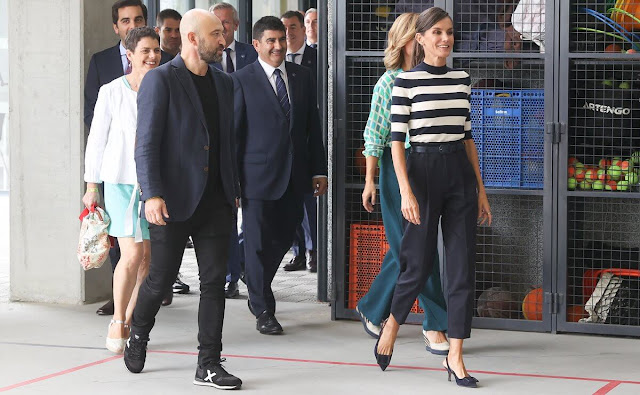 Hugo Boss navy trousers. Queen Letizia wore a new Faleena superfine merino stripe sweater by Hugo Boss