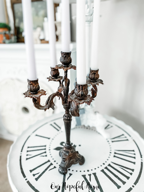 black rusted iron candelabra five white taper candles
