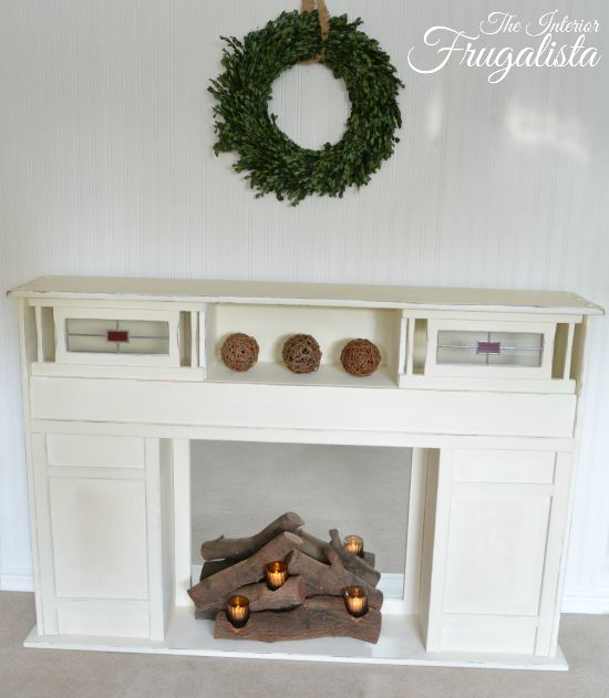 Give a faux fireplace the look of a cozy real fireplace with this real stacked log candle holder DIY fireplace insert, great for a real firebox too!