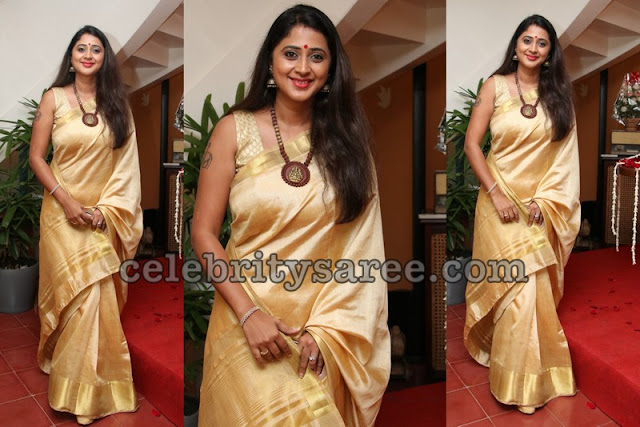 Kanika Cream and Gold Saree